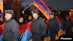 Armenia -- Riot police escort thousands of opposition supporters marching through central Yerevan, 18Feb2011.