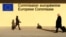 Belgium -- People walk past the Berlaymont building at the EU headquarters in Brussels, 06Feb2012