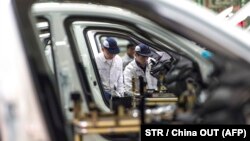 Radnici u fabrici, Kina
