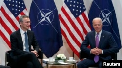 Then-Vice President Joe Biden meets with NATO Secretary-General Jens Stoltenberg (left) during the Munich Security Conference in Munich in February 2015.