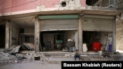 A destroyed shop in the eastern Damascus suburb of Ghouta on July 19.