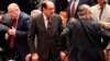 Iraqi Prime Minister Nuri al-Maliki (center) attends a session of parliament in Baghdad on July 1.