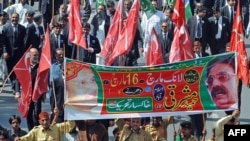 Lawyers and opposition activists march in Lahore.