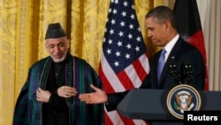Afghan President Hamid Karzai (left) with U.S. President Barack Obama at a joint news conference at the White House in January.