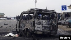 Daghestan -- A view shows a burnt vehicle near a damaged traffic checkpoint near the town of Derbent, February 15, 2016