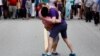 Canada - Men kiss in front of Canada's Prime Minister Justin Trudeau during the Vancouver Pride Parade in Vancouver, British Columbia, July 31, 2016. REUTERS/Ben Nelms