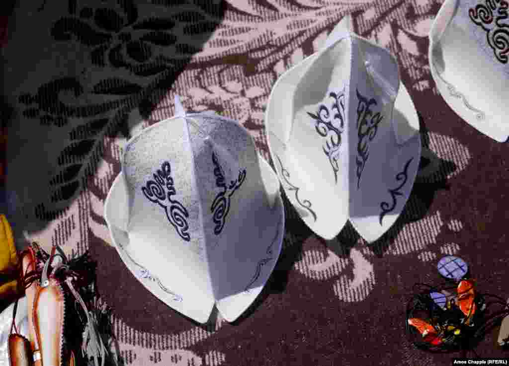 The hats: Kyrgyz hats on sale at the games were not the answer for those trying to protect big, pink noses from the sun. We were told the cut peak of the hats is to allow rainwater to drain out.