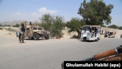 AFGHANISTAN -- Afghan security offcials check vehicles at a check point in Jalalabad, Afghanistan, 18 June 2017.