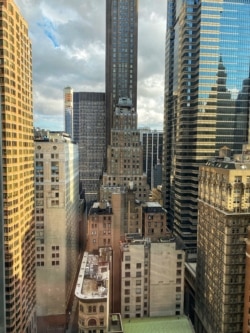 The view of New York City's financial district from the 25th floor of 20 Pine Street.