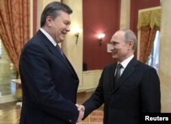 Vladimir Putin cu Viktor Ianukovici la Jocurile Ollimpice de iarnă de la Soci din februarie 2014.