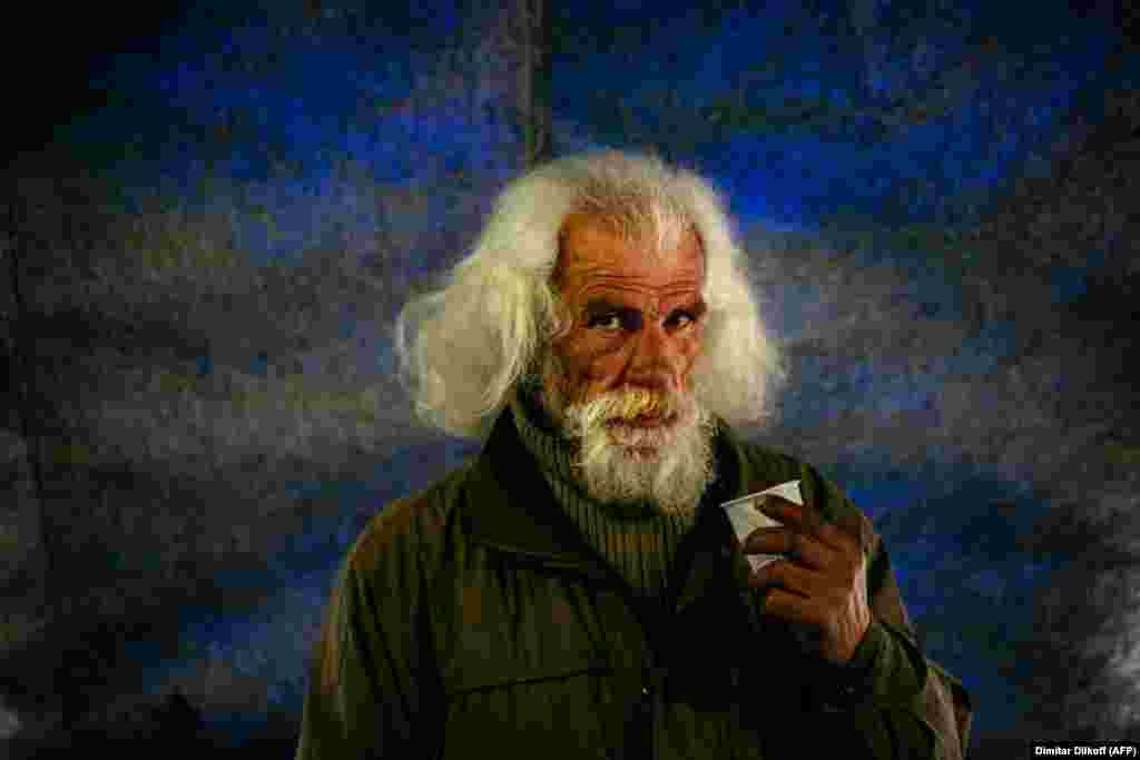 A homeless Russian man has a meal at at a center in Moscow on April 27. (AFP/Dimitar Dilkoff) 