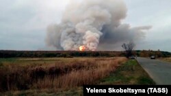 Smoke and fire are seen at the stricken ammunition depot in Russia's western Ryazan region.