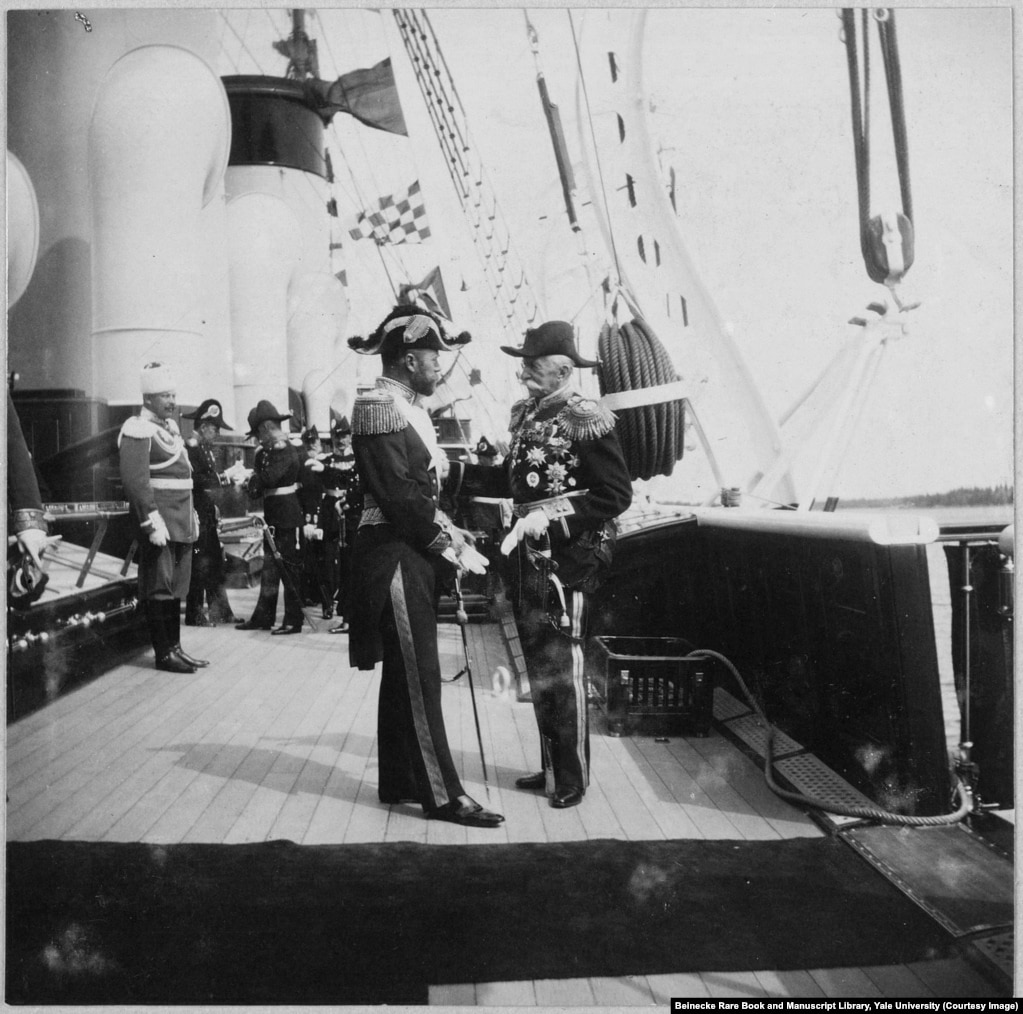 Tsar Nicholas II (left) greeting an unidentified man aboard the Standart. (A previous version of this caption incorrectly identified the man on the right as King Gustav of Sweden.)