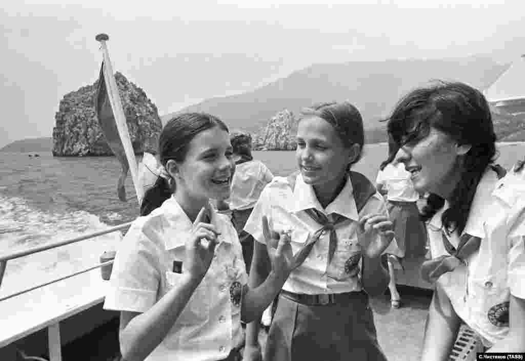 On a boat tour with her new Soviet friends off the Crimean coast.