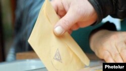 Armenia -- A voter casts a ballot.