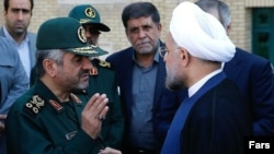 حسن روحانی (سمت راست)، رییس جمهوری ایران و محمد علی جعفری، فرمانده کل سپاه.