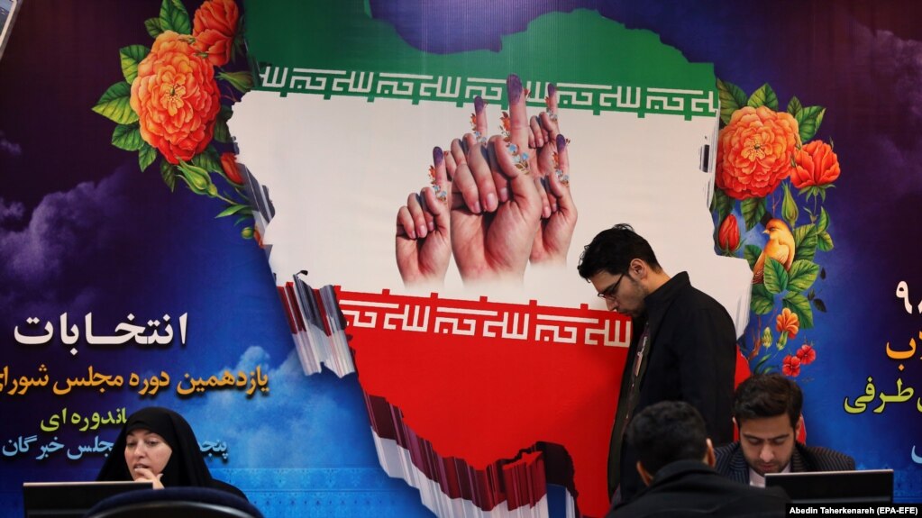 Iranians register for the upcoming parliamentary elections at the Interior Ministry in Tehran in December.