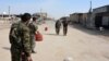 A file photo of fighters from Syrian Democratic Forces (SDF) patrolling in the city of Raqqa, which was once in the hands of Islamic State. 