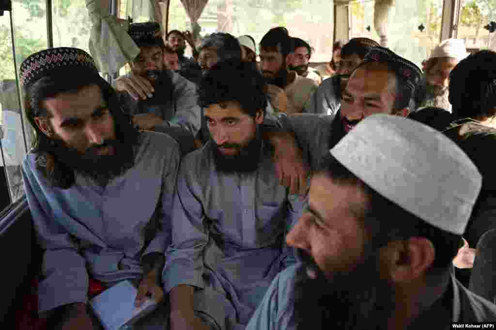 Taliban prisoners sit inside a vehicle during their release from Bagram prison.