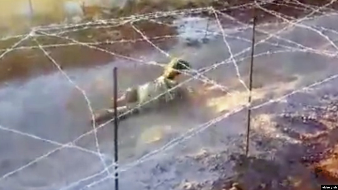 A screen grab from a video on the Facebook page of an Islamic State (IS) militant from Kazakhstan, Abu Aisha al-Kazakhi (aka Artyom Andreyev), shows a young child in military-style training.