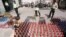 Iranian police prepare to destroy confiscated bottles of alcohol in Tehran.