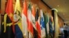 Algeria -- An Algerian security guard stands near the flags of member states of the Organization of the Petroleum Exporting Countries (OPEC) at the Sheraton hotel, Oran, 14Dec2008 