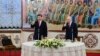 Chinese President Xi Jinping (left) and Russian President Vladimir Putin attend a reception in Moscow on March 21.