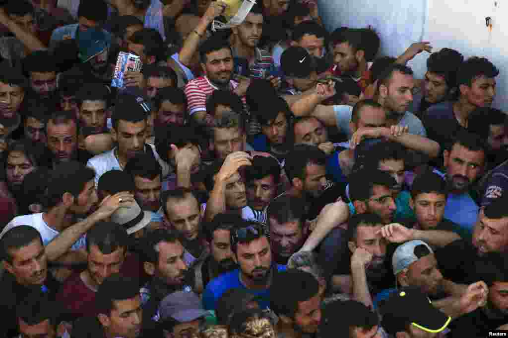 Migrants and refugees registering at a stadium on the Greek island of Kos. (Reuters/Alkis Konstantinidis)