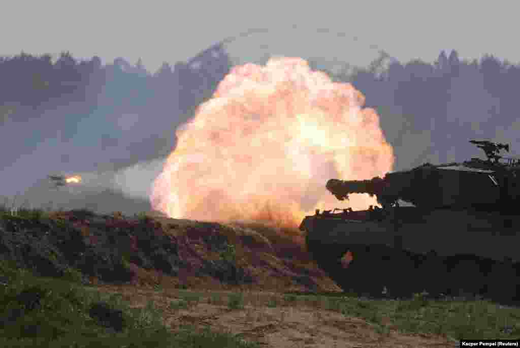 A Polish Leopard 2PL tank opens fire. The U.S. Army says the drills include more than 3,400 U.S. and 5,000 service members from 11 nations.