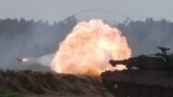 A Polish Leopard 2PL tank opens fire. The U.S. Army says the drills include more than 3,400 U.S. and 5,000 service members from 11 nations.