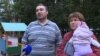 Russian Couple Threatened With Losing Their Children For Attending Rally Vow To Fight On