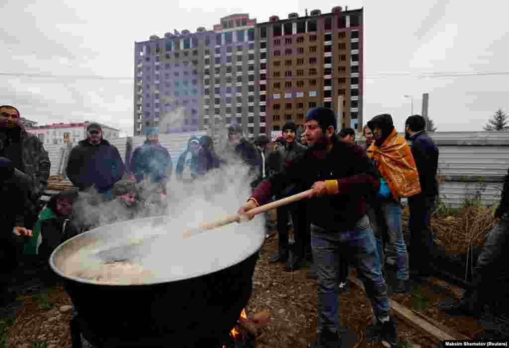 A man in Ingushetia&#39;s capital, Magas, prepares a meal during a protest against what participants say was an unfair land swap deal with the neighboring Russian region of Chechnya. (Reuters/Maxim Shemetov)