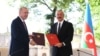 Turkish President Recep Tayyip Erdogan (left) and Azerbaijani President Ilham Aliyev attend a signing ceremony in Susa/Shushi in Nagorno-Karabakh on June 15.