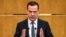Russian Prime Minister Dmitry Medvedev delivers a speech in the State Duma in Moscow on April 11: "We will not forget."