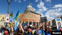 Ukrainians in Paris rally in memory of athletes killed during the war in Ukraine on July 13, two weeks before the start of the Paris 2024 Olympics and Paralympics Games.