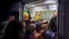 Wounded residents are seen inside an ambulance after a Russian air strike on Kharkiv on November 3.