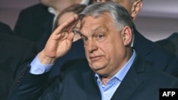 Prime Minister Viktor Orban salutes supporters in Budapest on April 12, 2026. Orban conceded election defeat to opposition leader Peter Magyar in a general election.
