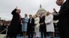 U.S. -- U.S. President Donald Trump takes the oath of office as his wife Melania holds the bible and his children Barron, Ivanka, Eric and Tiffany watch as U.S. Supreme Court Chief Justice John Roberts (R) administers the oath during inauguration ceremoni