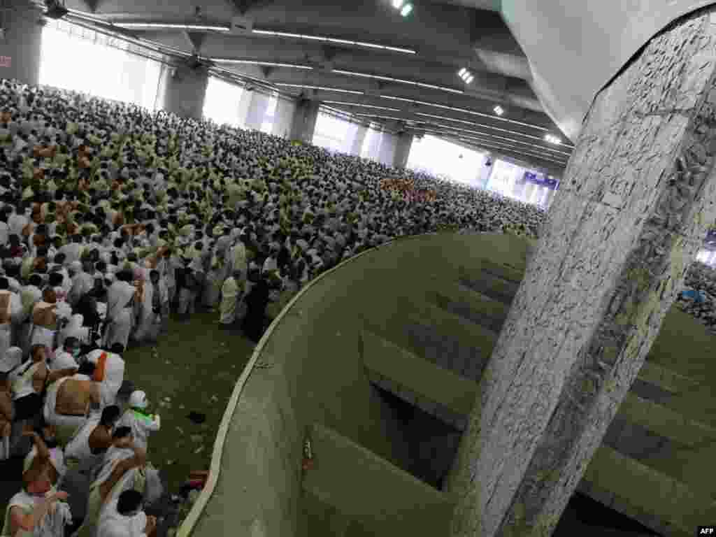 Seven pebbles are to be cast at any of three pillars during the ritual known as the stoning of the devil, in Mina near Mecca. (AFP PHOTO/MAHMUD HAMS)