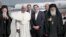 Pope Francis arrives on the Greek island of Lesbos on April 16 with Greek Prime Minister Alexis Tsipras (second from right), Greek Archbishop Ieronimos (far right), and Patriarch Bartholomew (left), the spiritual leader of Orthodox Christians.