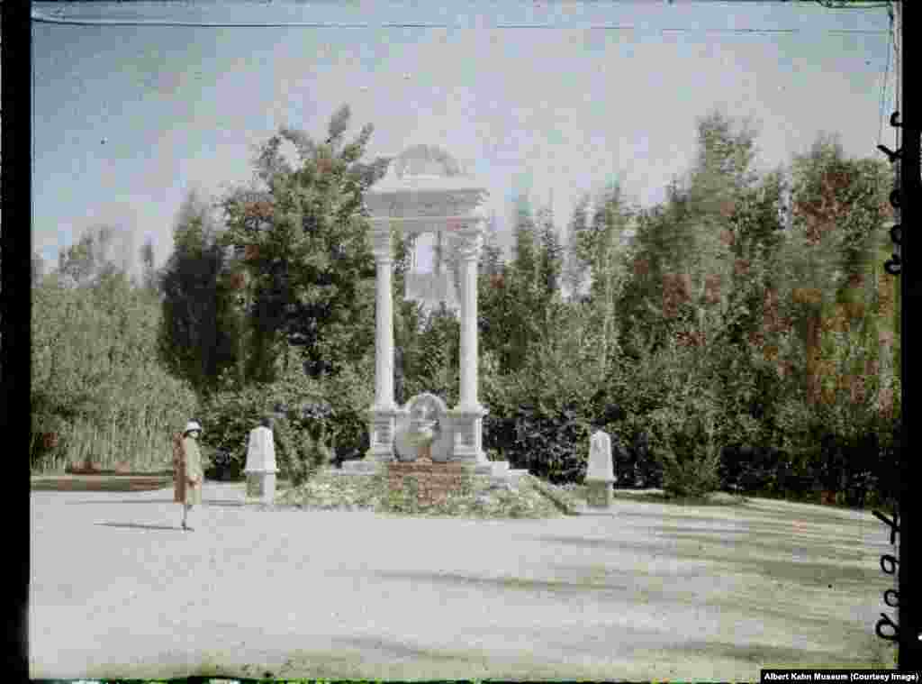 A European woman strolling through the Paghman gardens. Today the area is used for dog-fighting contests.