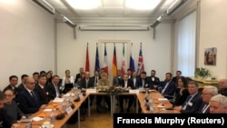 Iranian top nuclear negotiator Abbas Araqchi and EEAS Secretary General Helga Schmid attend a meeting of the JCPOA Joint Commission in Vienna, December 6, 2019