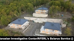 In this screenshot from footage taken by drone in October 2025, three of the houses nearing completion at the construction site near Krasnaya Polyana is visible.