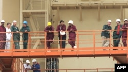 Russian and Iranian workers and technicians at the Bushehr nuclear power plant in February 2009