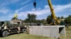 Romanian Army engineers install concrete shelters in the village of Plauru on the Danube River border between Romania and Ukraine on September 12, 2023.