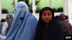 An Afghan woman pictured here with her daughter (file photo)