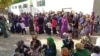 People line up outside a state grocery store to buy cooking oil in the Turkmen city of Mary.