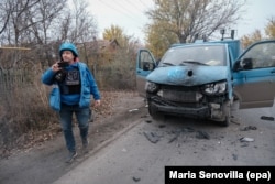 Tkachov films the aftermath of an FPV drone attack on his vehicle that had taken place seconds earlier.