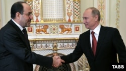 Russian President Vladimir Putin meets with Iraqi Prime Minister Nuri al-Maliki on October 10.