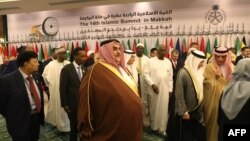 Bahrain's Foreign Minister Khalid bin Ahmed al-Khalifa (C) leaves after a family photo taken during a meeting of Islamic and Arab states' foreign ministers in Jeddah on May 30, 2019